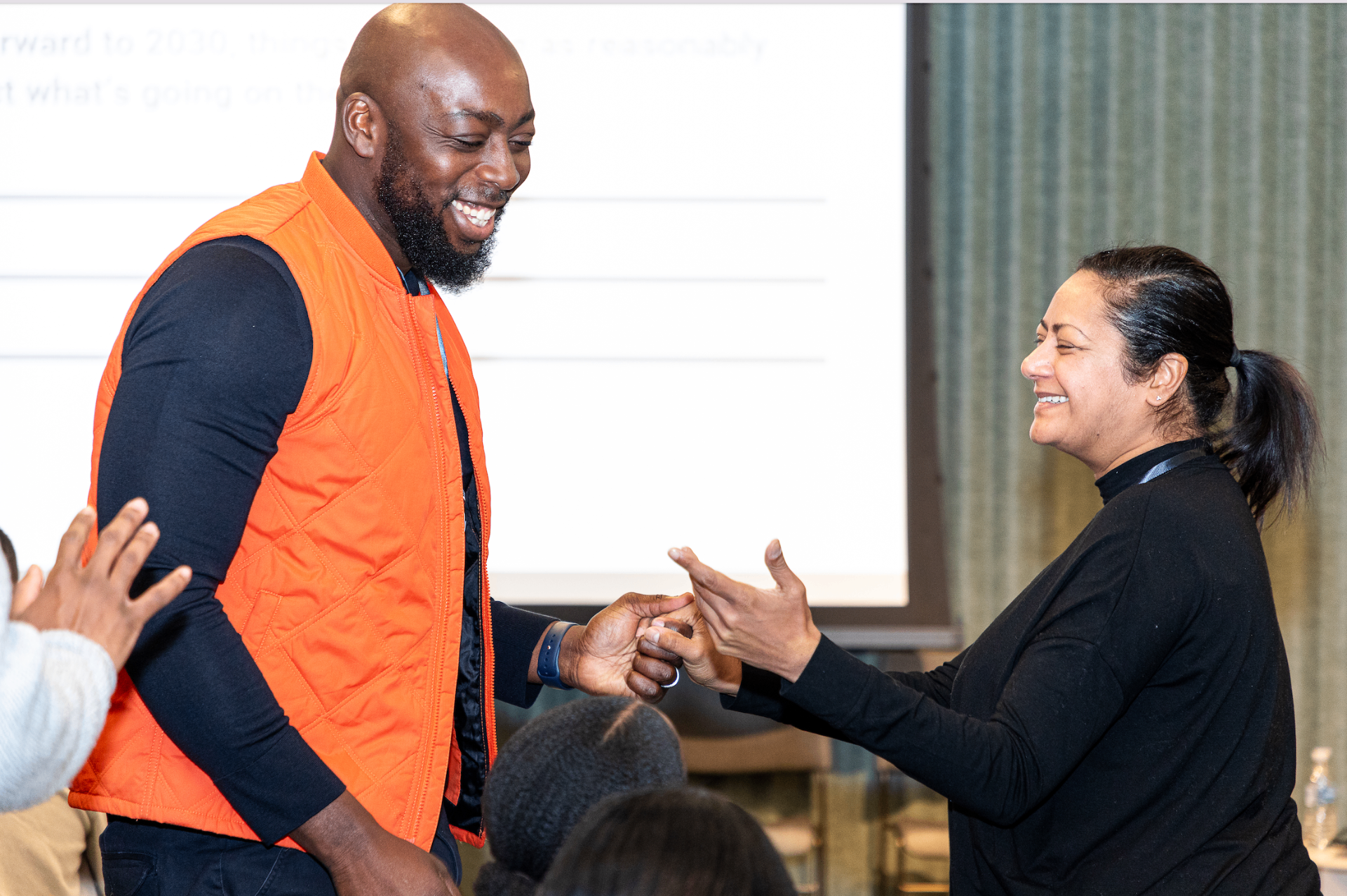 Members greeting one another during a session